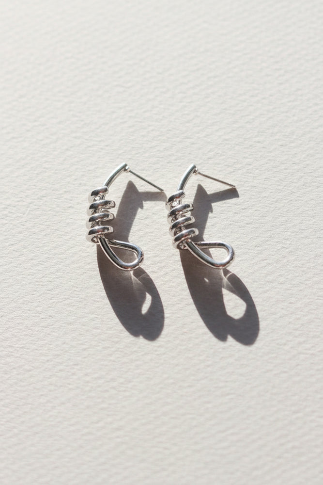 X-GOLD PLATED KNOT STUD EARRINGS